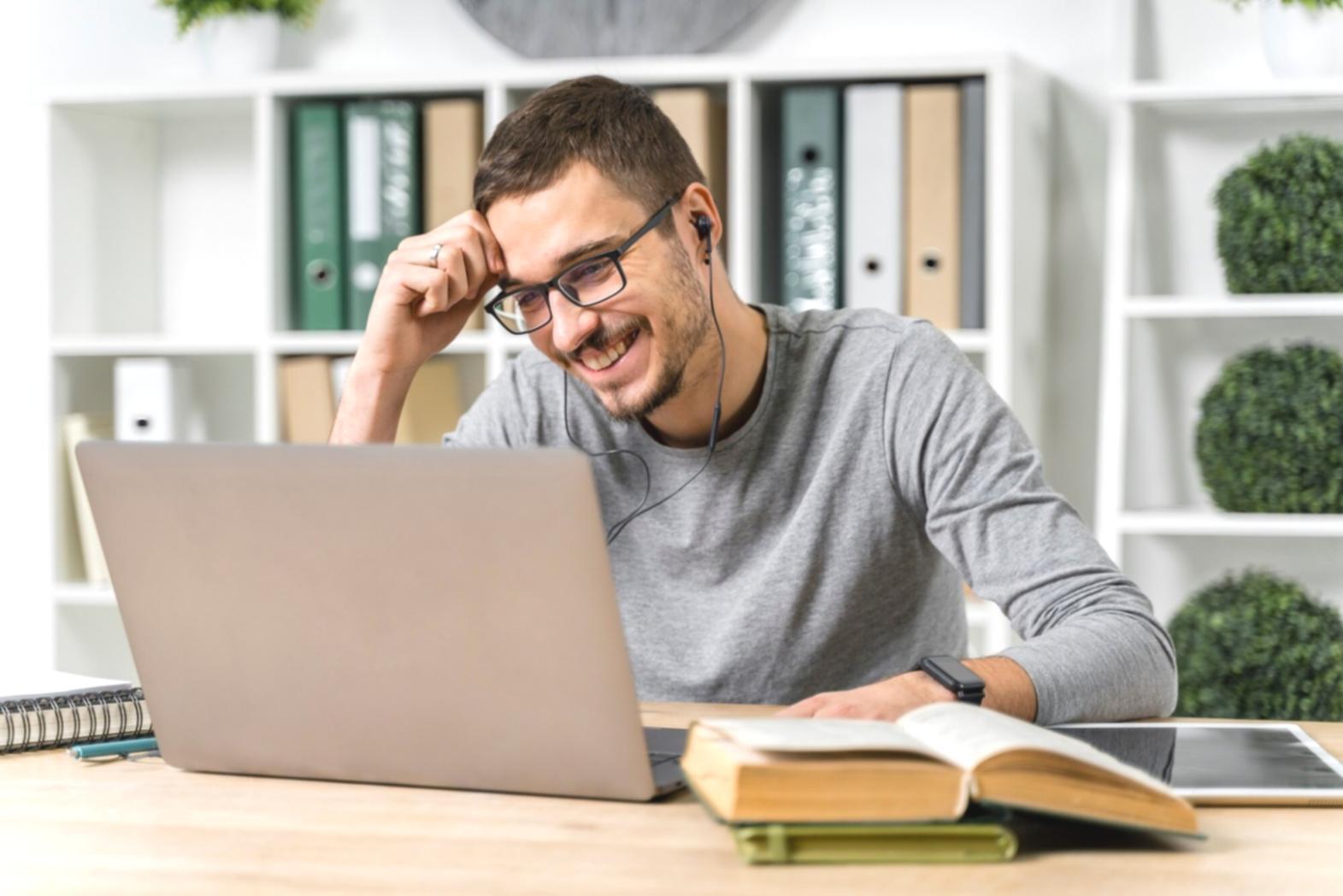 Student reviewing financial documents and taking notes